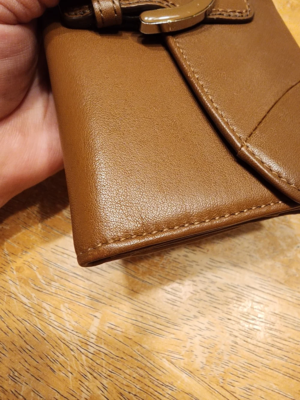 vintage Coach Soho Buckle Wallet crafted in brown leather prominent front Buckle